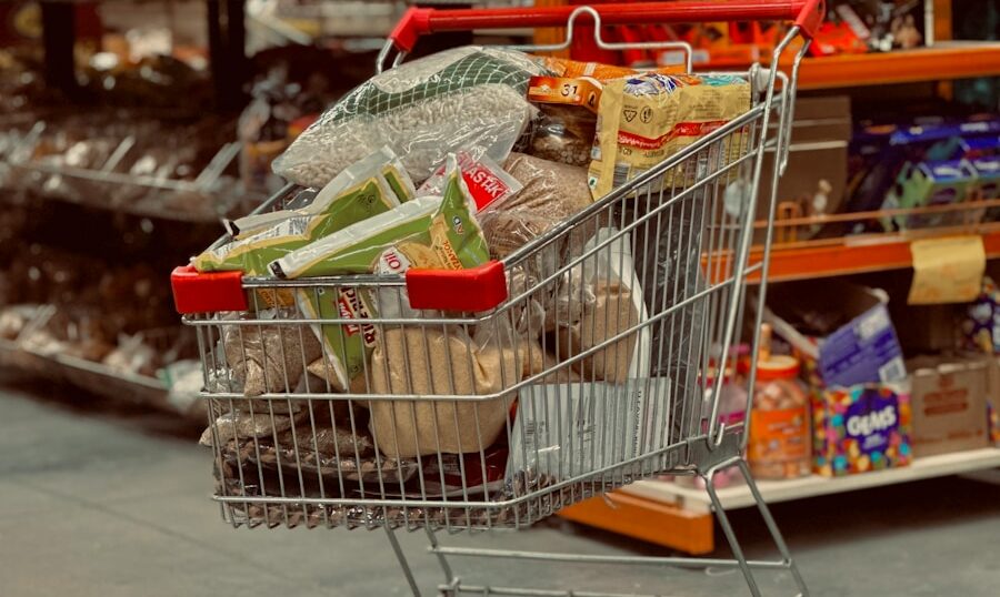 a shopping cart full of groceries in a grocery store